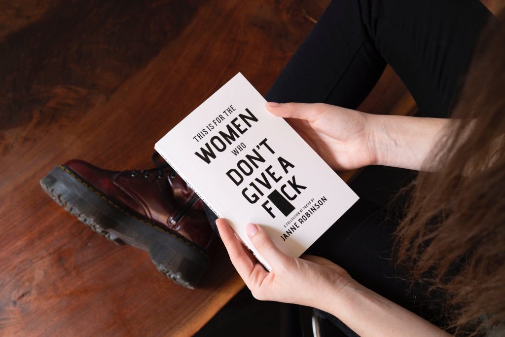 woman holding white book