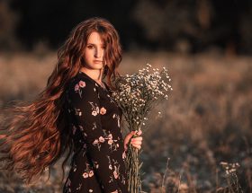 young woman in autumn flower field
