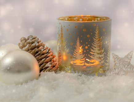 white and gold ceramic mug on white snow