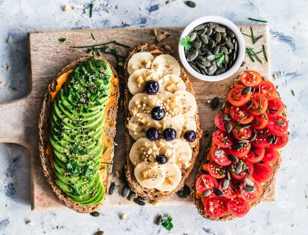 assorted fruits and vegetable on brown wooden chopping board